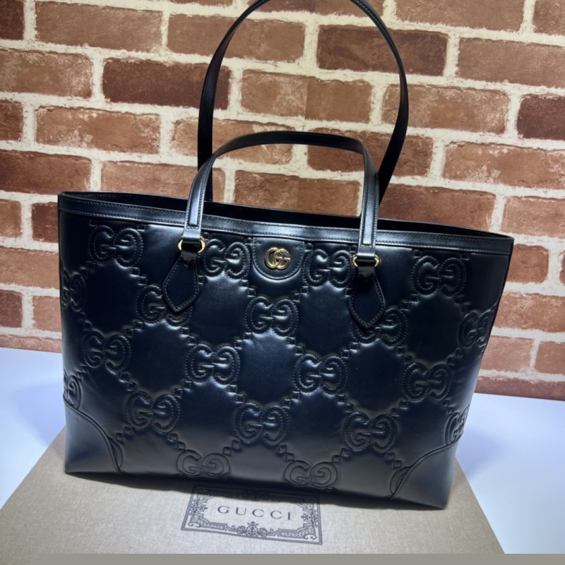 G*u*i shopping bags
